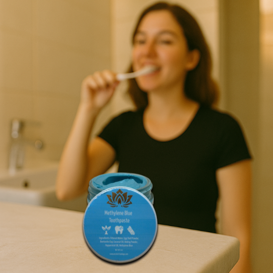 woman brushing teeth with methylene blue toothpaste
